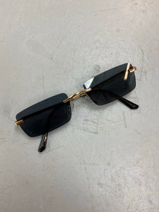 Black tinted gold metal framed sunglasses