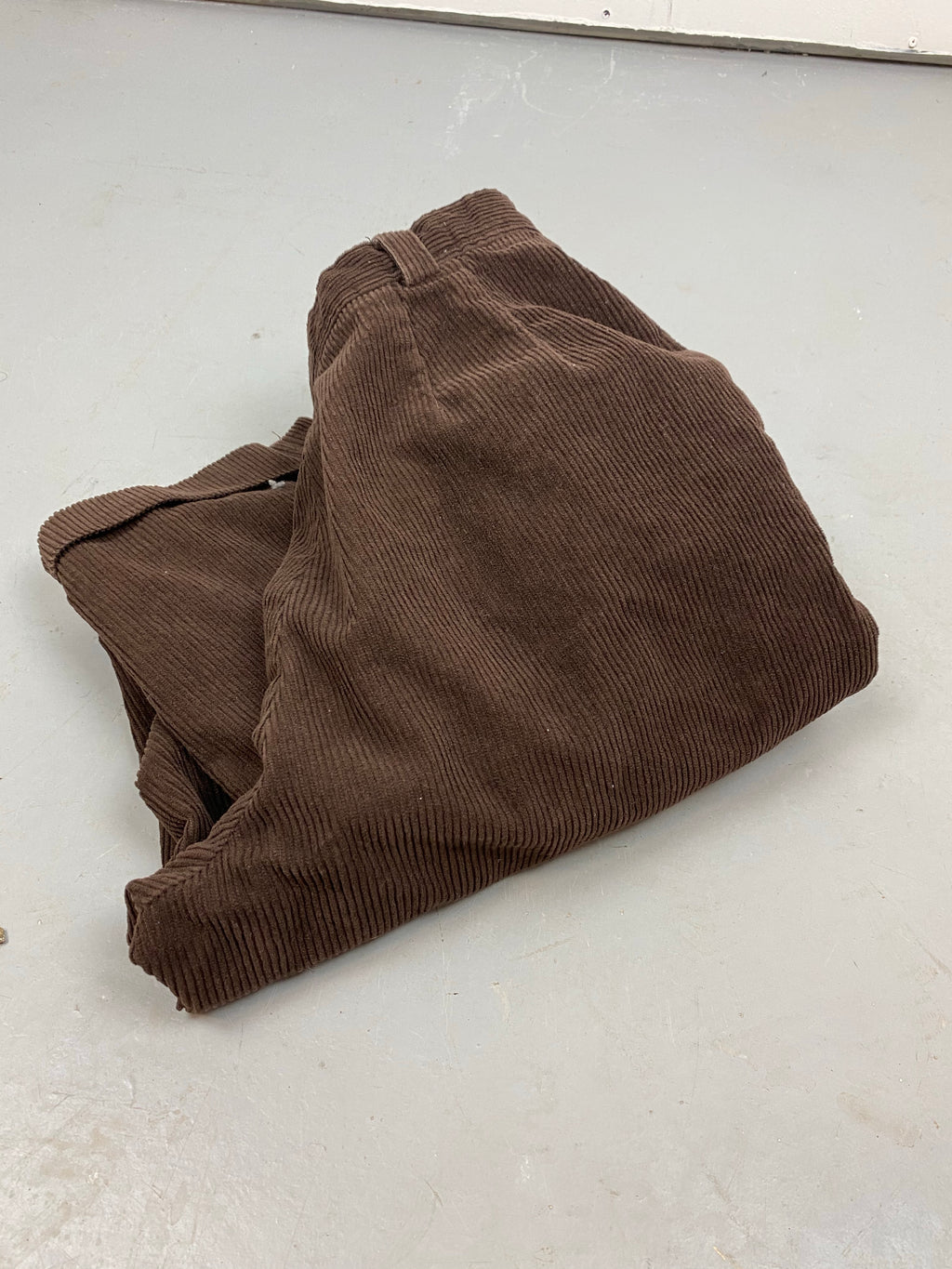 Chocolate brown pleated corduroy trousers