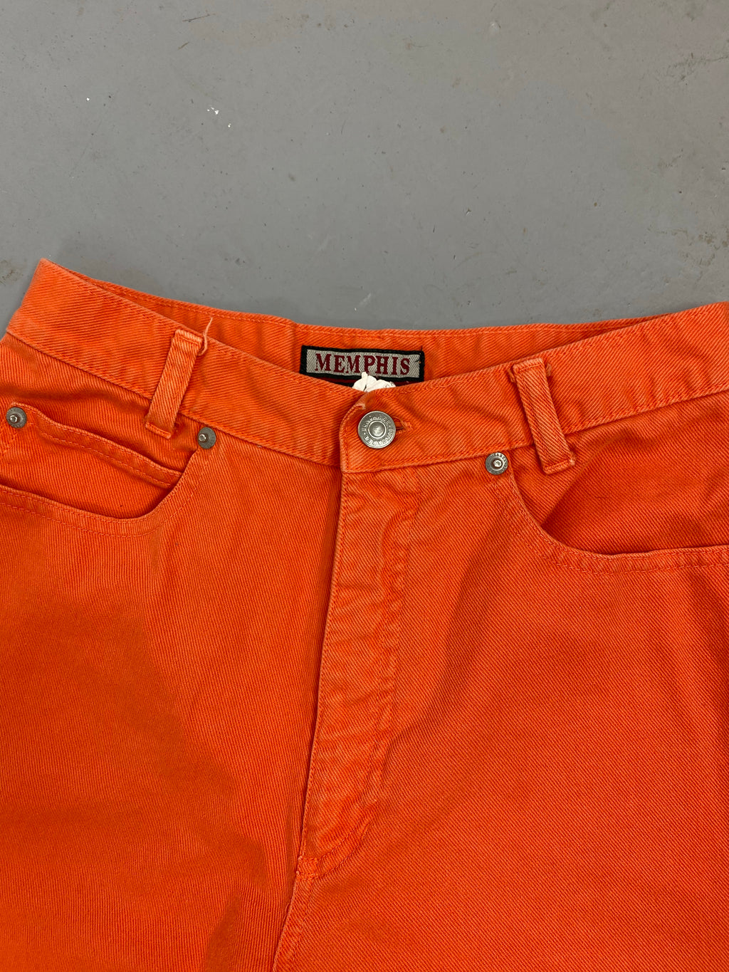 Orange high waisted frayed denim shorts
